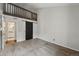 Cozy bedroom with sliding barn door, high ceilings, and carpet at 9797 E Peakview Ave # C10, Englewood, CO 80111