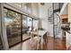 Bright dining area with access to a deck and adjacent to a unique spiral staircase at 9797 E Peakview Ave # C10, Englewood, CO 80111