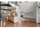 Open floor plan featuring kitchen, spiral staircase, and a stone fireplace at 9797 E Peakview Ave # C10, Englewood, CO 80111