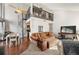 Living area with spiral staircase leading to a loft space; kitchen is nearby at 9797 E Peakview Ave # C10, Englewood, CO 80111