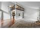 Bright living room features a spiral staircase, balcony, and an open floor plan at 9797 E Peakview Ave # C10, Englewood, CO 80111