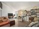 Comfortable living room offers a stone fireplace and open shelving for decor at 9797 E Peakview Ave # C10, Englewood, CO 80111