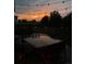 Outdoor patio set with string lights at dusk at 12693 W 82Nd Ln, Arvada, CO 80005