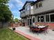 Cozy backyard with a patio, ideal for relaxation and gatherings, featuring comfortable seating and stylish lighting at 12693 W 82Nd Ln, Arvada, CO 80005
