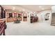 Expansive basement with bar area, fireplace, and seating, perfect for entertaining guests and Gathering at 12693 W 82Nd Ln, Arvada, CO 80005
