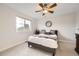 Bright bedroom featuring a ceiling fan, neutral walls and a window view to the outdoors at 12693 W 82Nd Ln, Arvada, CO 80005