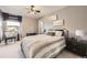 Comfortable bedroom with neutral-toned walls and a decorative table near the window at 12693 W 82Nd Ln, Arvada, CO 80005