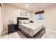 Comfortable bedroom featuring a neutral palette, carpeted floors, and a window at 12693 W 82Nd Ln, Arvada, CO 80005