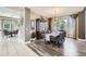 Elegant dining room with stylish chandelier, wood floors, and a large window for natural light at 12693 W 82Nd Ln, Arvada, CO 80005