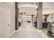 Spacious foyer with tile flooring and an open staircase leading to the upper level at 12693 W 82Nd Ln, Arvada, CO 80005