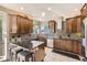 Modern kitchen with granite countertops, stainless steel appliances, and a breakfast bar with seating at 12693 W 82Nd Ln, Arvada, CO 80005