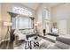 Inviting living room with high ceilings, ample natural light, and comfortable seating at 12693 W 82Nd Ln, Arvada, CO 80005