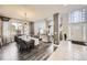 Open-concept living area seamlessly integrates dining and lounging with abundant natural light at 12693 W 82Nd Ln, Arvada, CO 80005