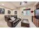 Cozy media room boasts plush seating, and entertainment area with lots of space at 12693 W 82Nd Ln, Arvada, CO 80005