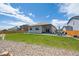 Spacious backyard with a patio, wooden fence, rock beds and ample green space at 14670 Guernsey Dr, Mead, CO 80542