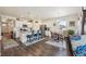 Bright kitchen featuring a center island with bar seating, stainless steel appliances, and an adjacent dining area at 14670 Guernsey Dr, Mead, CO 80542