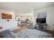 Spacious open-concept living area showcasing a well-lit kitchen, comfortable living room setup, and seamless flow throughout at 14670 Guernsey Dr, Mead, CO 80542