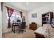 Well-lit home office with a desk, comfortable chair, and ample storage space for a productive workspace at 14670 Guernsey Dr, Mead, CO 80542