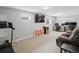 Spacious finished basement with exercise equipment and seating area at 18093 E Milan Pl, Aurora, CO 80013