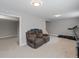 Finished basement is complete with a sectional and treadmill at 18093 E Milan Pl, Aurora, CO 80013