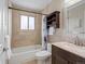 Neutral bathroom with updated vanity and shower over tub at 18093 E Milan Pl, Aurora, CO 80013