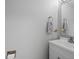Updated bathroom with white vanity and neutral paint at 18093 E Milan Pl, Aurora, CO 80013