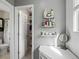 Well-lit bathroom boasts a walk-in closet and vanity at 18093 E Milan Pl, Aurora, CO 80013
