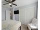 Bright bedroom featuring a mounted TV and closet for ample storage at 18093 E Milan Pl, Aurora, CO 80013