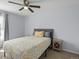 Cozy bedroom features a ceiling fan and comfortable furnishings at 18093 E Milan Pl, Aurora, CO 80013