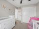Bright bedroom with dresser and closet at 18093 E Milan Pl, Aurora, CO 80013