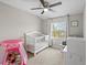 Light and airy bedroom with vaulted ceilings, ceiling fan, and bright window at 18093 E Milan Pl, Aurora, CO 80013