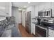 Updated kitchen features stainless steel appliances and stylish countertops at 18093 E Milan Pl, Aurora, CO 80013