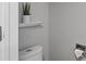 Neutral powder room with toilet and gray paint at 18093 E Milan Pl, Aurora, CO 80013