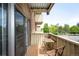 Inviting outdoor balcony space with wood flooring and patio furniture for enjoying the outdoors at 4110 Hale Pkwy # 3K, Denver, CO 80220