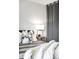 Cozy bedroom close-up of the bed highlighting stylish lamps and comfortable decorative pillows at 4110 Hale Pkwy # 3K, Denver, CO 80220