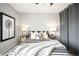 Comfortable bedroom showcases stylish bedding, two bedside tables, and neutral wall decor at 4110 Hale Pkwy # 3K, Denver, CO 80220