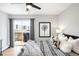 Bright bedroom featuring a ceiling fan, balcony access, and neutral decor for a calming atmosphere at 4110 Hale Pkwy # 3K, Denver, CO 80220