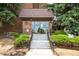 Inviting building entrance with well-maintained landscaping and a welcoming entryway at 4110 Hale Pkwy # 3K, Denver, CO 80220