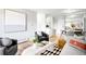 Open living area blending living and dining, complemented by modern furniture and décor at 4110 Hale Pkwy # 3K, Denver, CO 80220