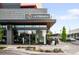 Corner view of Le French restaurant with a black sign, large windows, and outdoor seating area at 4110 Hale Pkwy # 3K, Denver, CO 80220