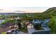 Expansive aerial view of a suburban neighborhood nestled amongst rolling green hills and lush landscaping at 1820 Sapling Ct, Castle Rock, CO 80109