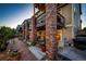 Charming home featuring a well-lit outdoor patio, perfect for entertaining or relaxing in the evening at 1820 Sapling Ct, Castle Rock, CO 80109