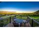Private balcony with comfortable seating, offering stunning panoramic views of the golf course and town at 1820 Sapling Ct, Castle Rock, CO 80109
