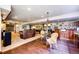 Spacious basement with a wet bar, seating and a pool table for endless entertainment possibilities at 1820 Sapling Ct, Castle Rock, CO 80109
