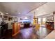 Finished basement with dark wood floors featuring a bar and table perfect for entertaining at 1820 Sapling Ct, Castle Rock, CO 80109