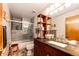 Stylish bathroom with a sleek vanity, modern fixtures, and a glass shower/tub combination at 1820 Sapling Ct, Castle Rock, CO 80109