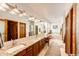 Bright, expansive bathroom with double vanity, granite countertops, soaking tub, and separate shower at 1820 Sapling Ct, Castle Rock, CO 80109