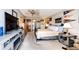 Spacious bedroom with a walk-in bathroom, ceiling fan, neutral walls and a decorative bed frame at 1820 Sapling Ct, Castle Rock, CO 80109