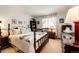 Inviting bedroom featuring a comfortable bed, a large window, and classic decor at 1820 Sapling Ct, Castle Rock, CO 80109