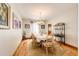 Bright dining room with hardwood floors, a chandelier, and seating for six at the dining table at 1820 Sapling Ct, Castle Rock, CO 80109